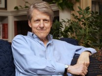 Robert Shiller, one of three American scientists who won the 2013 economics Nobel prize, poses at his home in New Haven